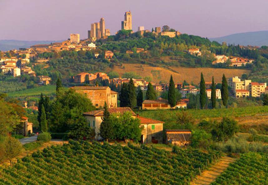 A landscape with a hill and trees and buildings<br />
<br />
AI-generated content may be incorrect.
