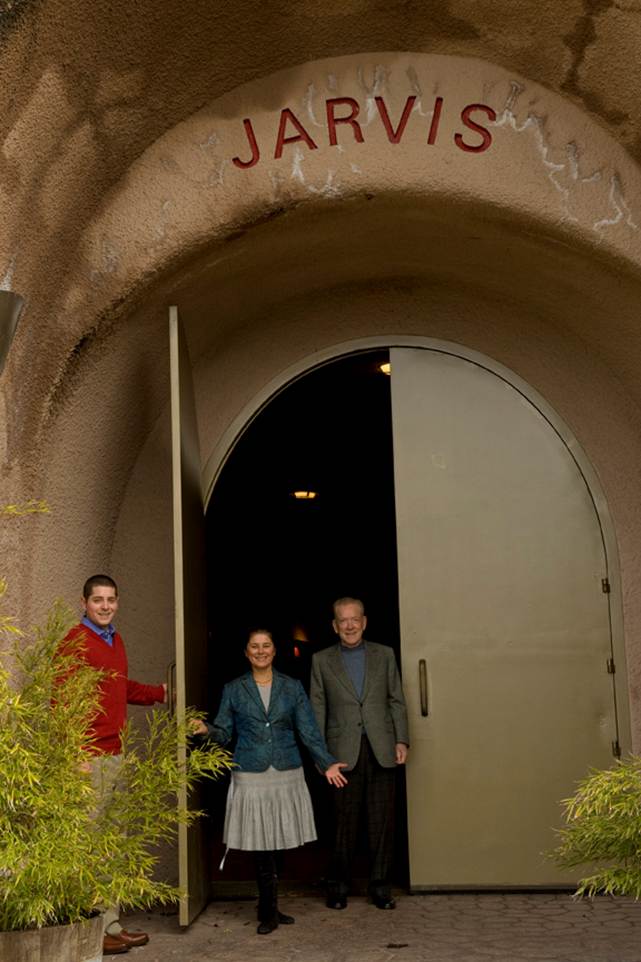 A group of people standing in a doorway<br />
<br />
AI-generated content may be incorrect.